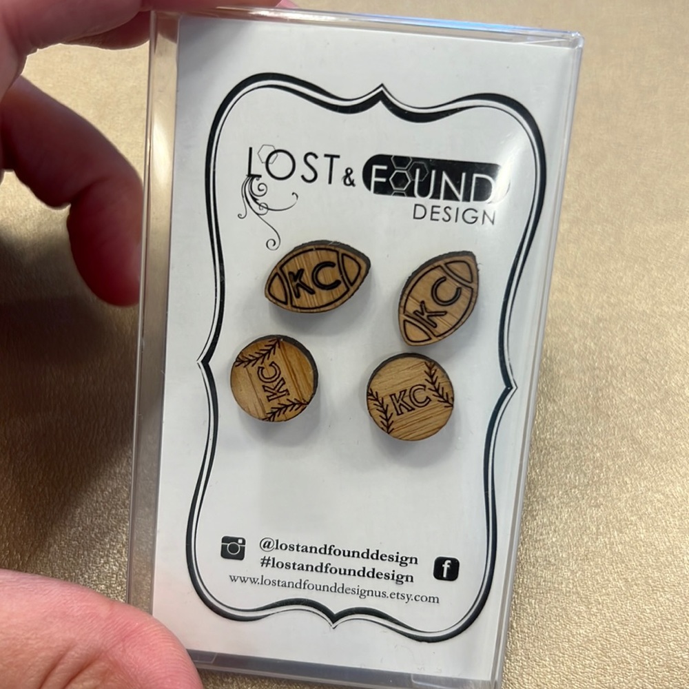 Two pairs wooden KC earrings.
